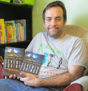 Proud papa of the hardcover and trade paperback editions of THE SEVENTH EQUINOX. Yes, those are children's books behind me. No, they have nothing in common with my novel. Yes, I need to shave. It just keeps growing, for some reason.