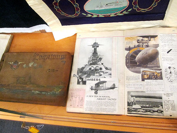 A couple of his scrapbooks. The one on the left is closed to show off its beautiful, hand-painted, leather cover. The one on the right is open to a typical page of articles he clipped from newspapers and magazines.
